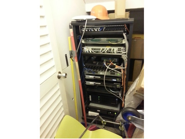 A rack and housing in a server room